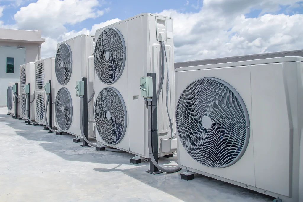 air conditioning hvac roof industrial building with blue sky clouds scaled